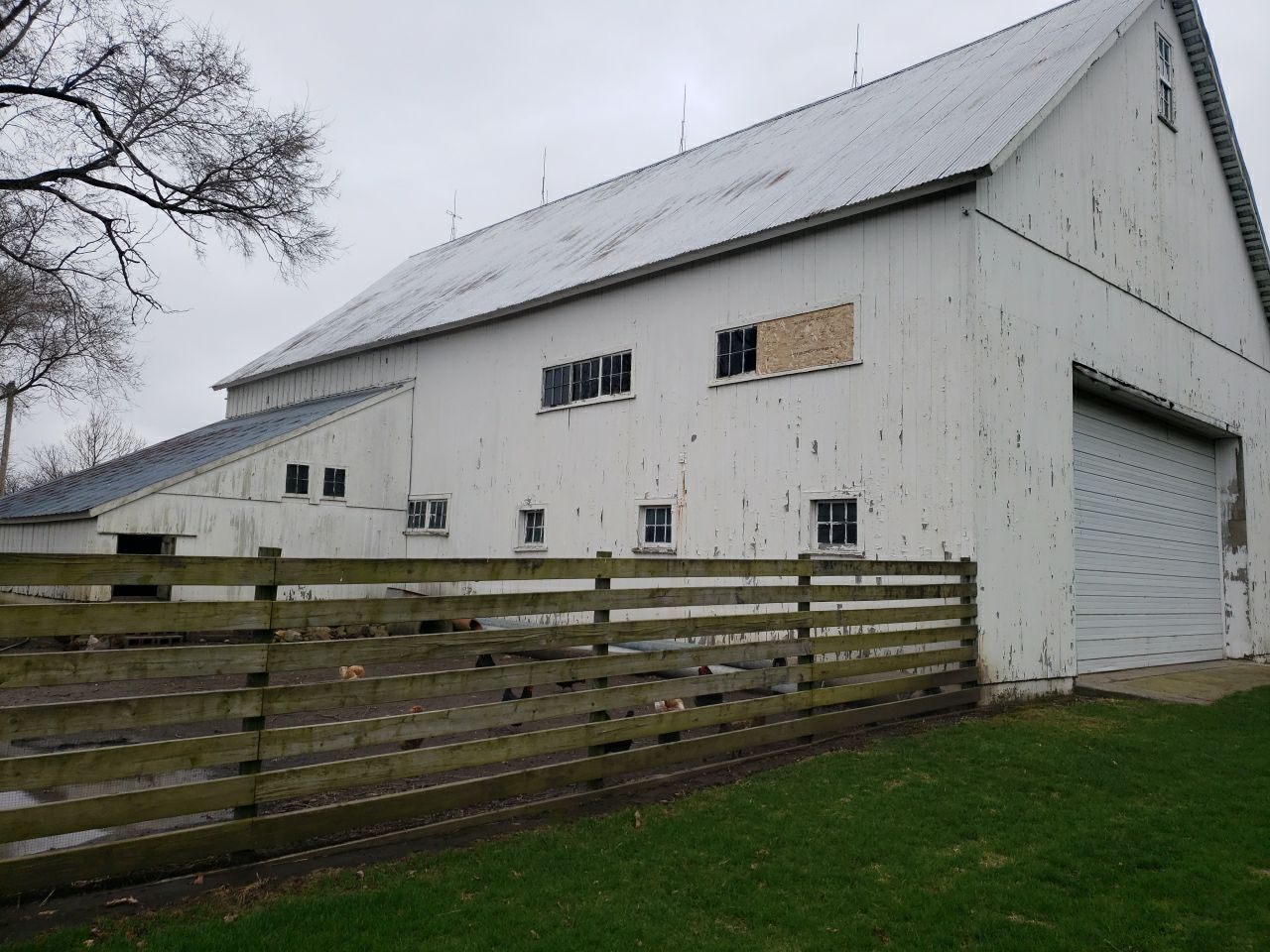 Horse Barn Restoration with Board and Batten Siding Before Picture